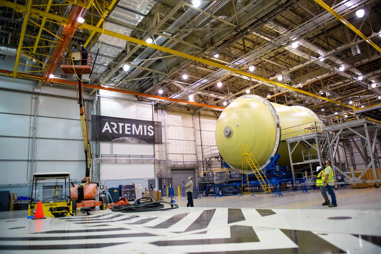 Employees wear personal protective gear at  Michoud Assembly Facility as the facility transitioned to Stage 3 of NASA’s Framework for Return To On-Site Work. Employees wear the appropriate personal protective equipment (PPE) and/or cloth face coverings as required for assigned tasks. Access to the facility is limited to authorized personnel working on mission-critical tasks that must be conducted onsite. Mission-critical tasks include slowly and methodically resuming Space Launch System (SLS) Core Stage and Orion production activities, particularly critical path deliverables to support the Artemis Program, at a pace that limits personnel and follows federal guidelines for social distancing and use of personal protective equipment such as face masks. For more information about SLS, visit nasa.gov/sls.